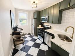 Gothic-meets-mid-century 2BR in Lakeview | Statement Kitchen + Dining for 4